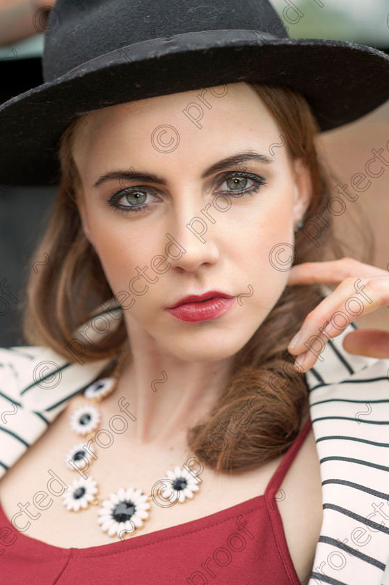 D4S0100 pp 
 Pretty brunette wearing a wide brimmed hat, outdoors editorial fashion portrait 
 Keywords: pretty,brunette,lady,hat,portrait,editorial,fashion,outdoors,lips,eyes,necklace,striped jacket