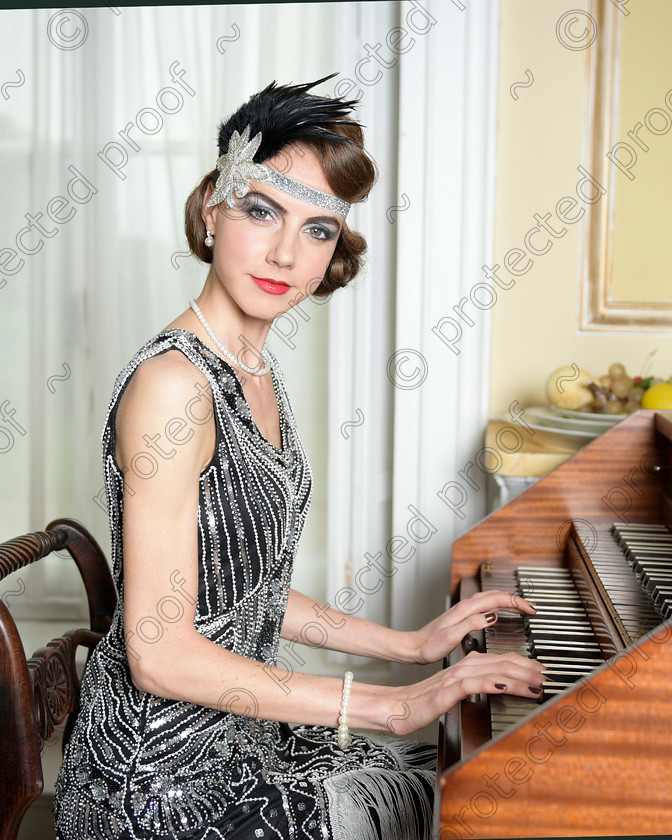 D4S9643 
 Twenties style brunette sitting at a harpsichord dressed in black flapper evening dress 
 Keywords: Twenties
Roaring Twenties
Roaring 20s
Flapper
Brunette
pretty girl
lady
portrait
vintage
theme
portrait
sequins